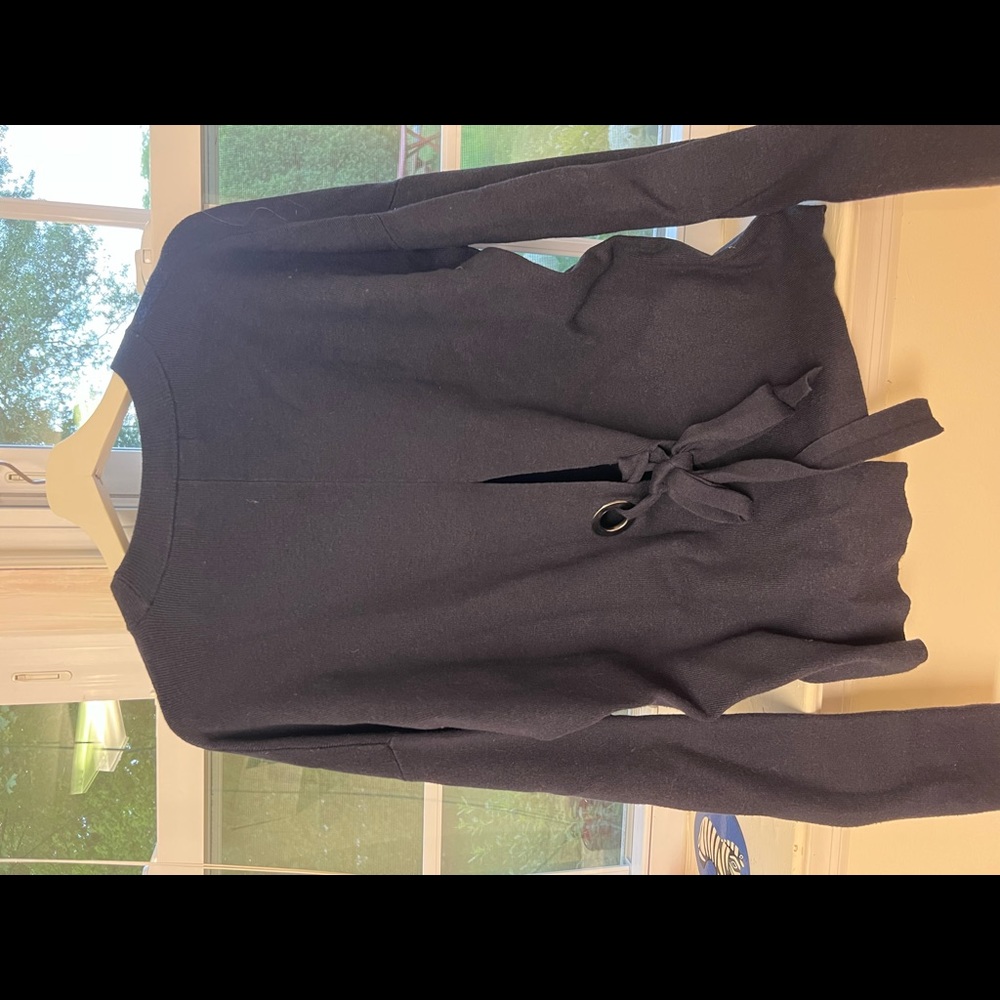 Blue sweatshirt. With knot on the back.